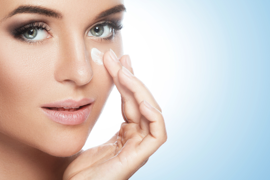 Women applying under eye cream